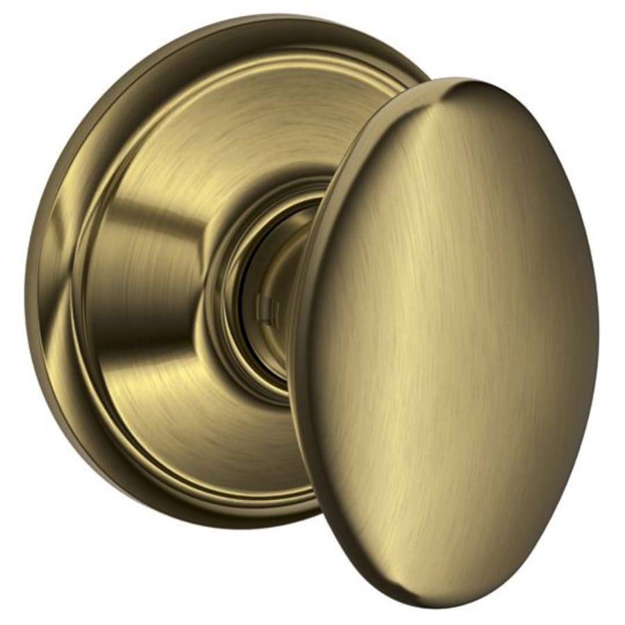 NEW Schlage Antique Brass Finish Passage Doorknob Oval Style Series C - Landmark Auction Co